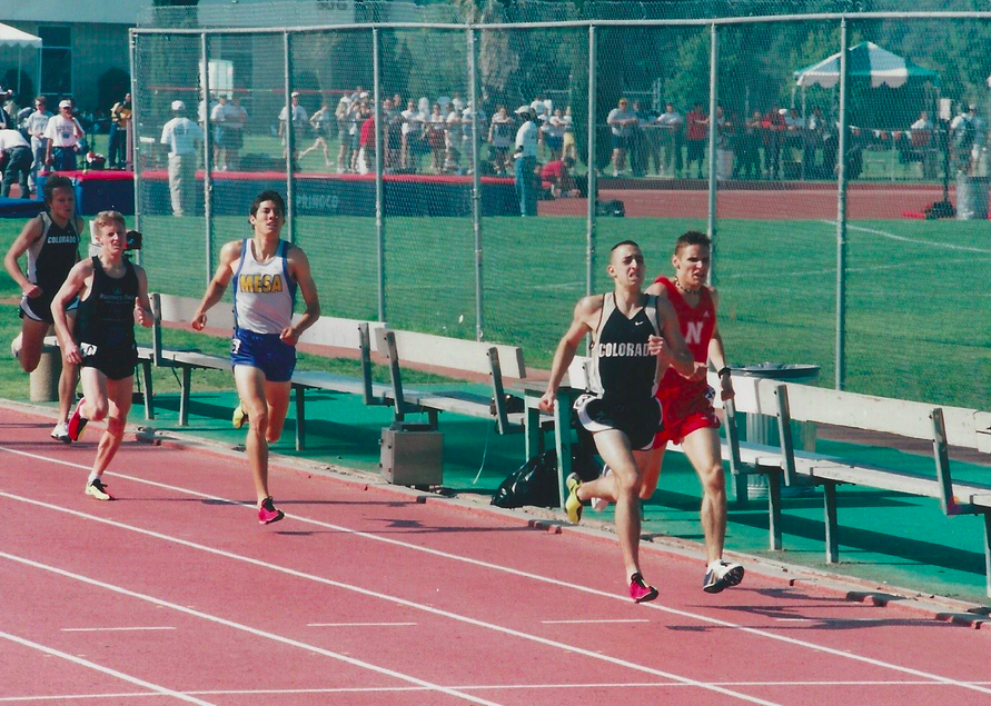 Mt. SAC 1500 meters, 1999. Jay is the Colorado runner at the far left edge of the photograph, barely in the frame, behind a Colorado teammate who is near the front at right.